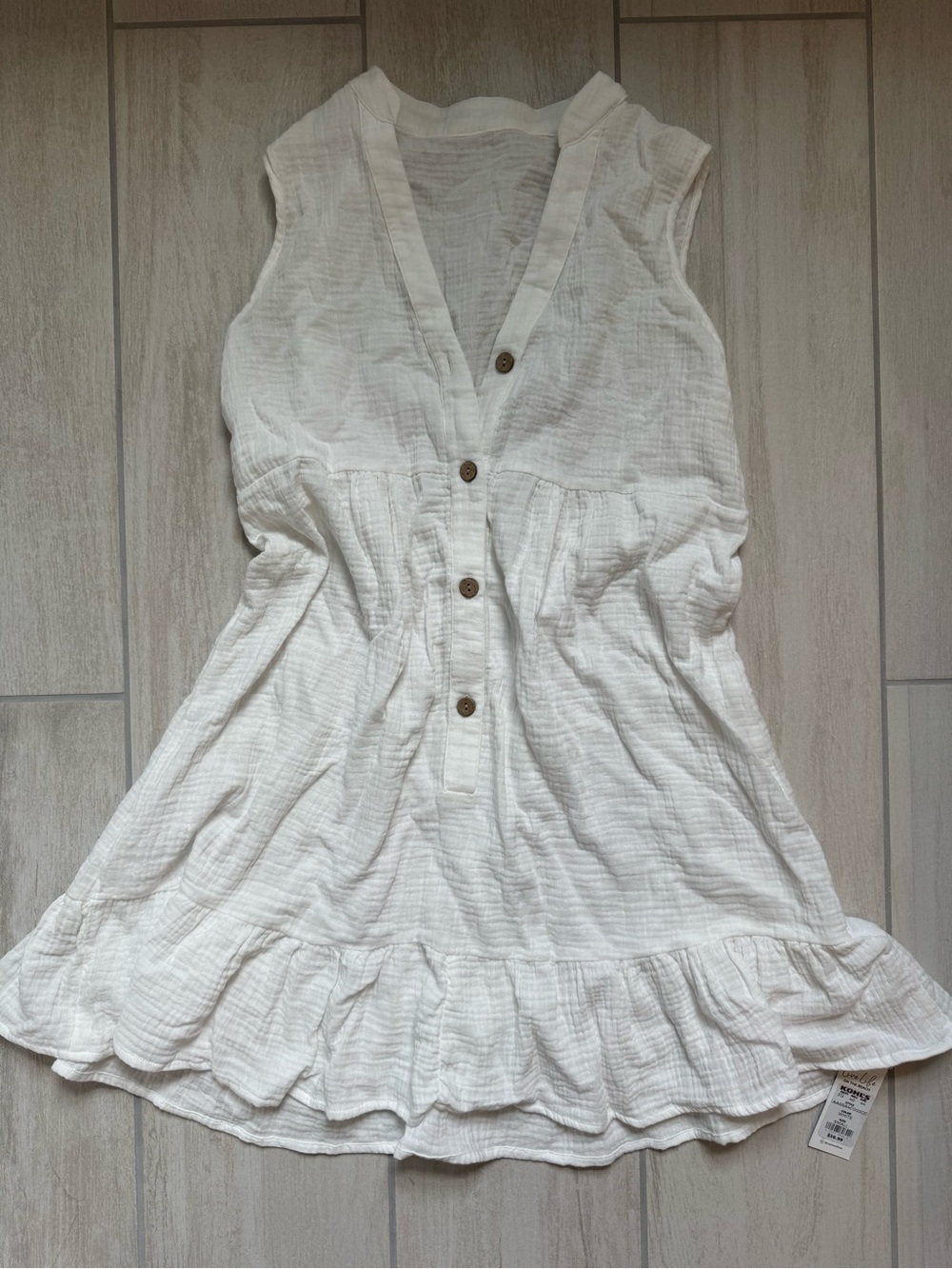 Sleeveless White Button Front Ruffled Hem Dress
